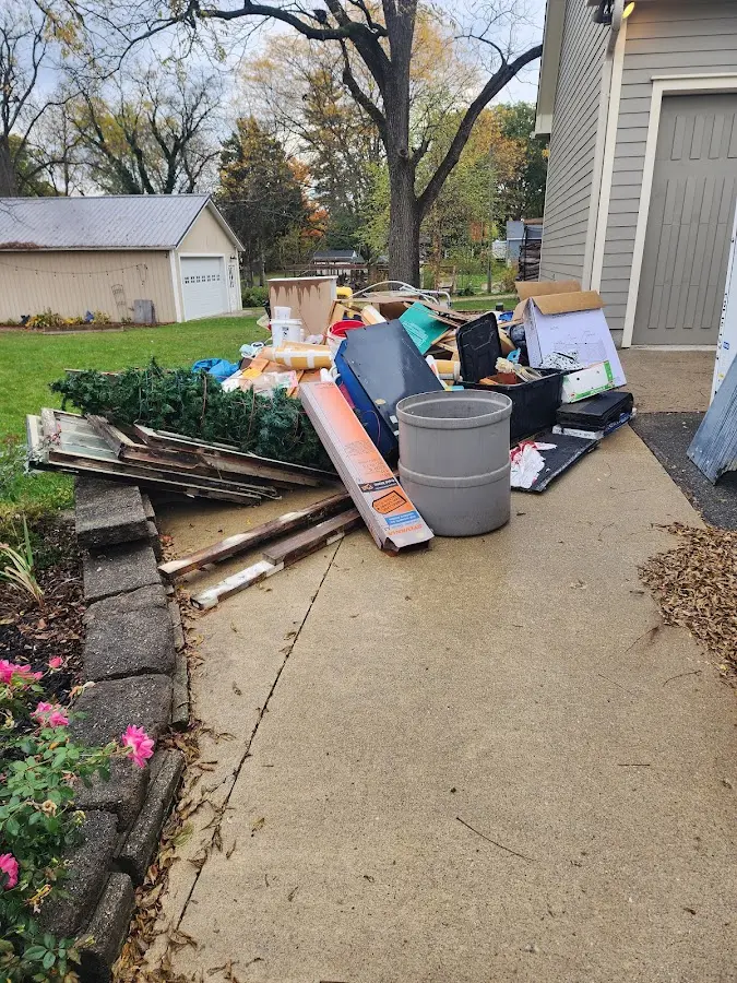 Dumpster being loaded with debris for Estate Cleanout Dumpster Rental in Corte Madera